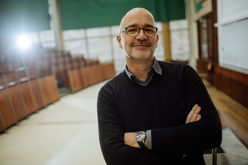 Portrait-of-smiling-professor-in-the-amphitheater-1128666909_2125x1416 Crown Organizations