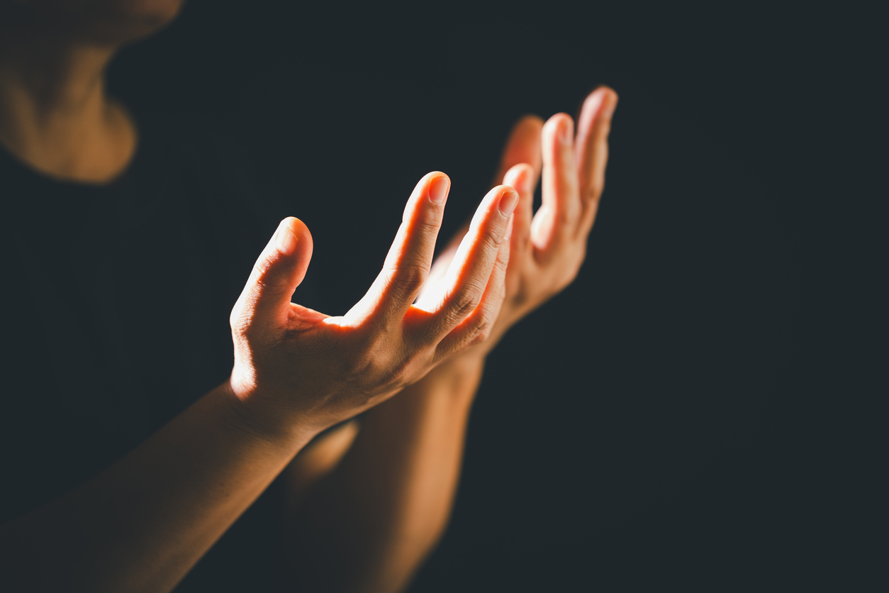 Dark Silence Of The Church, A Christian Lifts Their Hand In Prayer To God, A Symbol Of Worship, Faith, And Hope Embracing The Spiritual Concept Of Religion And Believing In Jesus Christ.